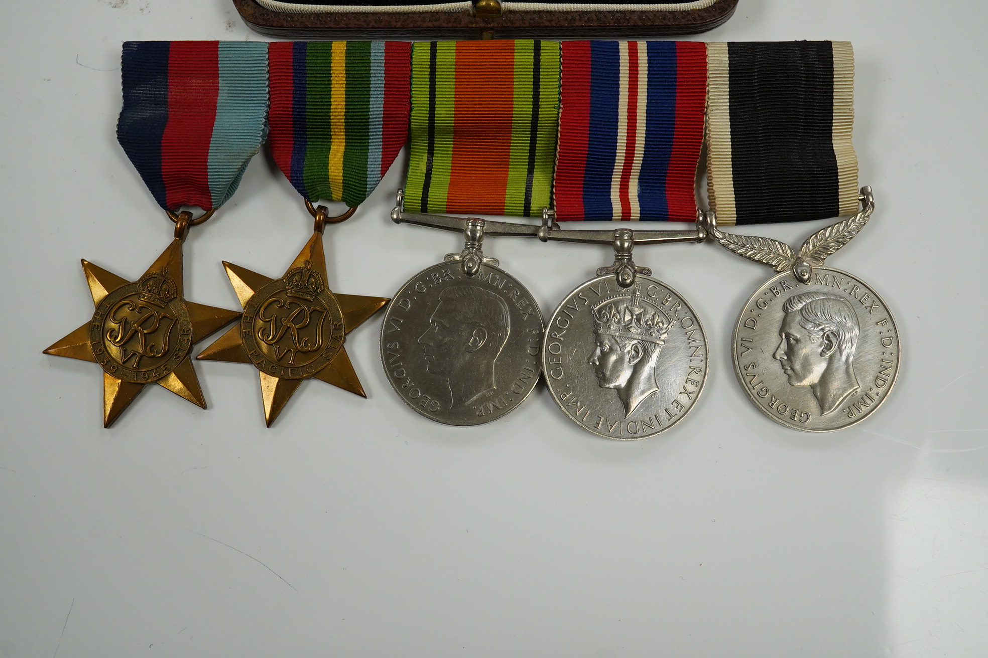 A New Zealand medal group, group of five medals including; The Service to New Zealand Medal 1939-1945, the Pacific star, the 1939 to 1945 star, etc. together with the cased miniature group. Condition - good